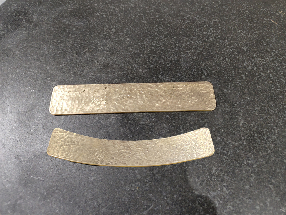 Comparison of embossed copper plate before and after leveling